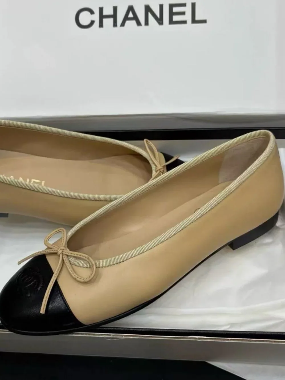 CHANEL Two‑Tone Bow‑Trim Leather Round‑Toe Ballet Flats